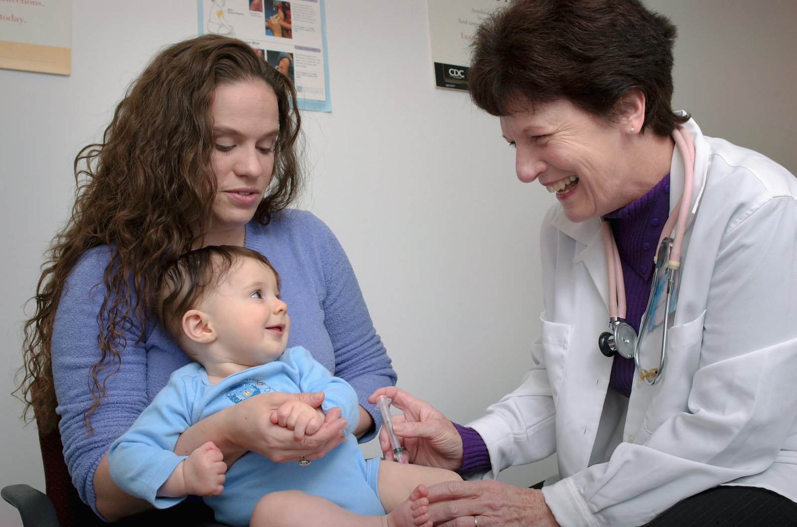 Paediatrician examining a young child in the clinic