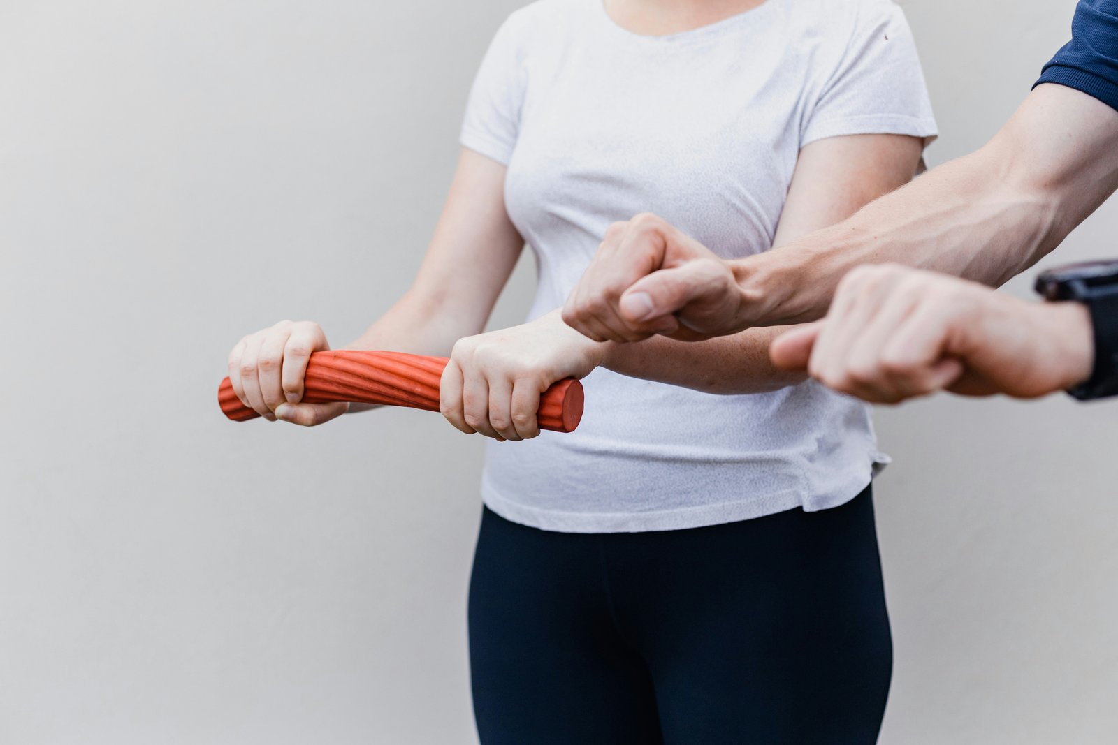 Physiotherapist assisting patient with knee rehabilitation exercise